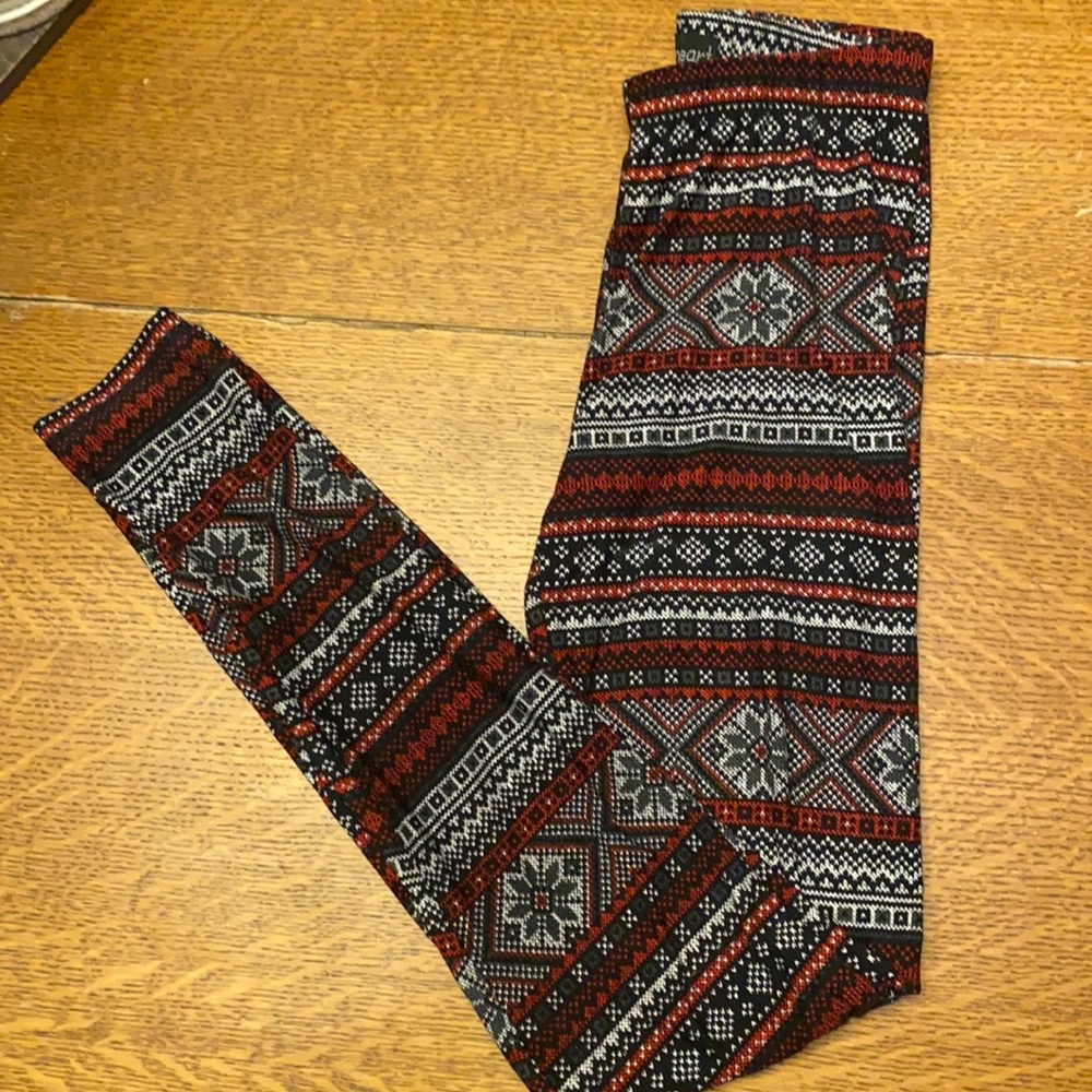 Woman’s Christmas leggings; size small